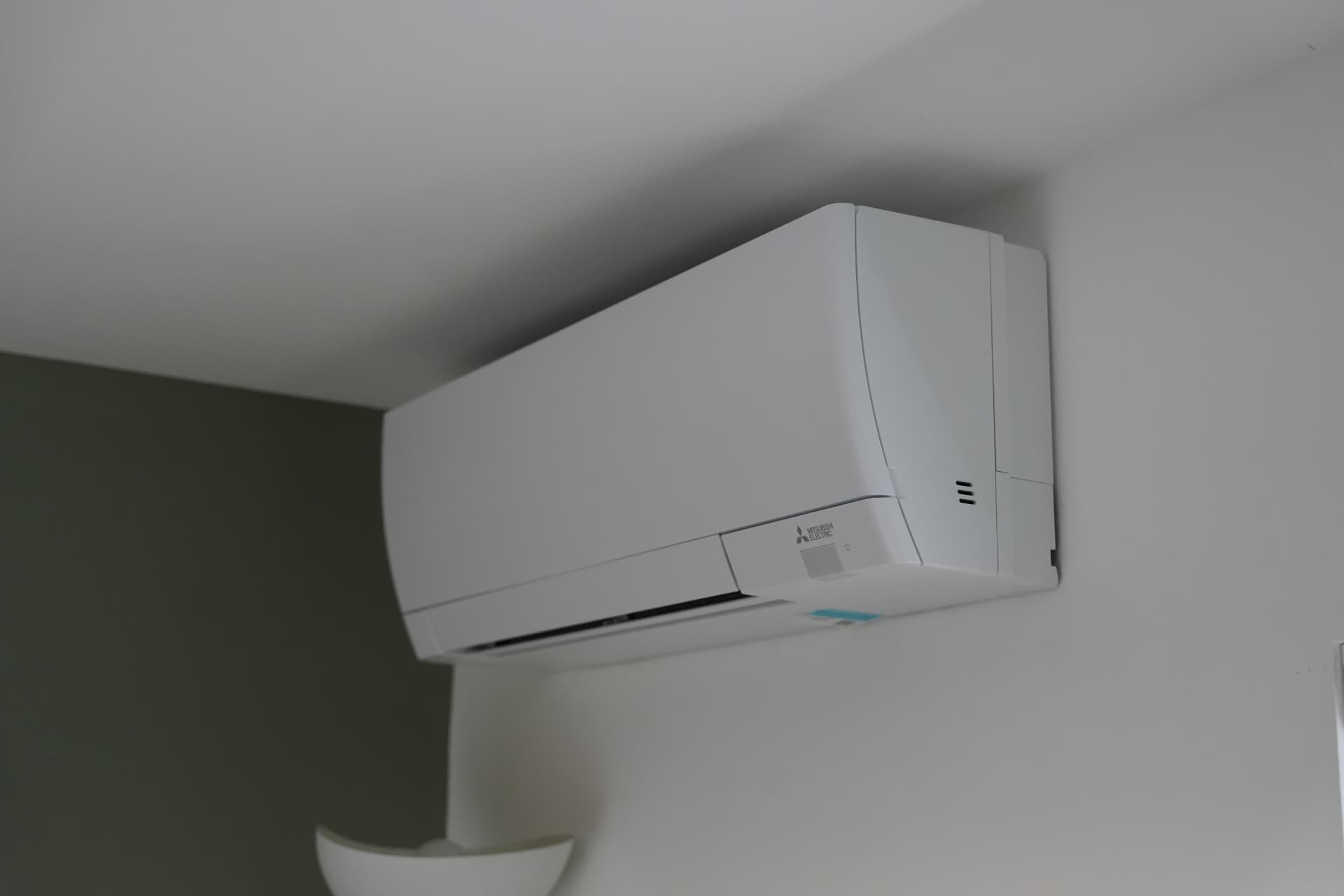 Wall-mounted air conditioning unit fitted high in a Youth Talk office