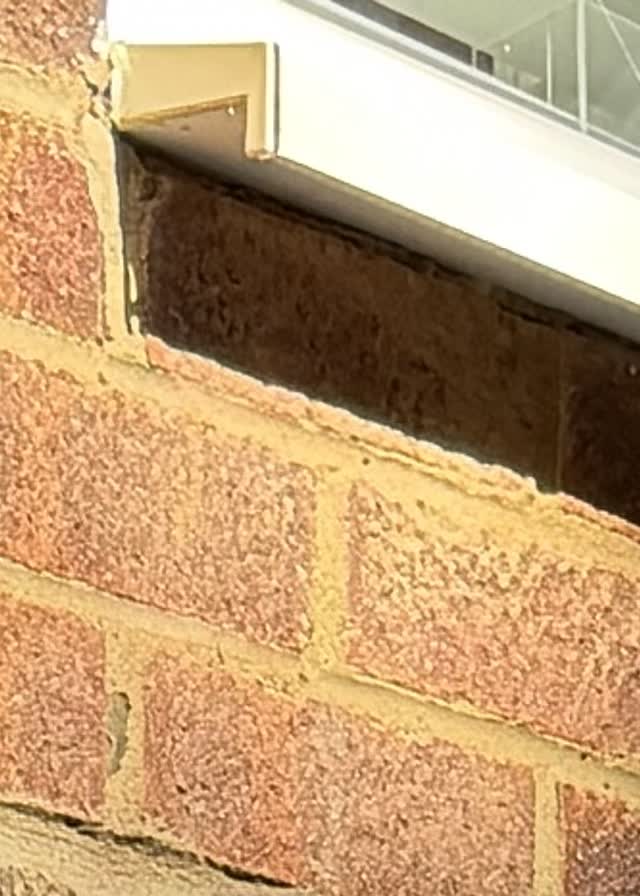 Neatly finished external brickwork on a Haier air conditioning installation